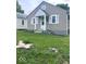 Charming home featuring light tan siding and a cozy front entrance at 4715 Normal Ave, Indianapolis, IN 46226