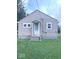 Traditional home featuring light tan siding, inviting entrance and small front yard at 4715 Normal Ave, Indianapolis, IN 46226