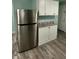 Spacious kitchen featuring stainless steel refrigerator and bright, white cabinetry at 4715 Normal Ave, Indianapolis, IN 46226