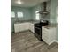 Well-equipped kitchen featuring stainless steel appliances, granite countertops, and stylish backsplash at 4715 Normal Ave, Indianapolis, IN 46226