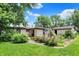 Charming backyard with flowering garden, trees, and inviting outdoor space at 4770 Willow Rd, Zionsville, IN 46077