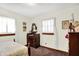 Bright bedroom with natural light, vintage dresser, and classic wooden trim at 4770 Willow Rd, Zionsville, IN 46077