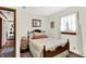 Charming bedroom with a cozy bed, vintage accents, and a bright window with sheer curtains at 4770 Willow Rd, Zionsville, IN 46077
