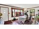 Charming dining room with hardwood floors, bright light fixture, and windows with shutters at 4770 Willow Rd, Zionsville, IN 46077