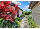 Charming side yard with stepping stone pathway and vibrant plantings at 4770 Willow Rd, Zionsville, IN 46077