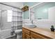 Updated bathroom with modern fixtures, stylish vanity, and shower-tub combo at 5126 Hillside Ave, Indianapolis, IN 46205