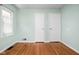 Bedroom featuring hardwood floors and natural light from a side window at 5126 Hillside Ave, Indianapolis, IN 46205