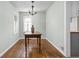 The dining area boasts hardwood floors and natural light, perfect for intimate meals and gatherings at 5126 Hillside Ave, Indianapolis, IN 46205
