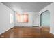 A light and bright living room with hardwood floors and neutral color palette, and modern finishes at 5126 Hillside Ave, Indianapolis, IN 46205