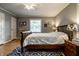 Comfortable bedroom features neutral colors, natural light, and hardwood floors at 5261 N Pennsylvania St, Indianapolis, IN 46220