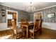 Charming dining room with elegant chandelier and hardwood floors at 5261 N Pennsylvania St, Indianapolis, IN 46220