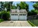 Two-car garage with detailed roof and basketball hoop, set back from the street at 5261 N Pennsylvania St, Indianapolis, IN 46220