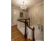 Traditional staircase with white railing and dark wood accents at 5261 N Pennsylvania St, Indianapolis, IN 46220