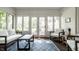 Bright sunroom with large windows and comfortable seating at 5261 N Pennsylvania St, Indianapolis, IN 46220