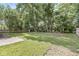 A spacious backyard featuring mature trees and partial fence for added privacy at 5289 Pine Hill Dr, Noblesville, IN 46062