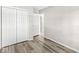 Another bedroom featuring hardwood style flooring, closet and white trim at 5289 Pine Hill Dr, Noblesville, IN 46062