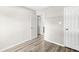 Hallway shows wood-look floors, fresh paint, trim and doors leading to the other rooms at 5289 Pine Hill Dr, Noblesville, IN 46062