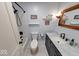 The updated bathroom offers a tub and shower combination and a modern vanity at 608 W 600 N, Fortville, IN 46040