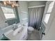 A full bathroom with modern vanity, tub and shower combination, and great lighting at 608 W 600 N, Fortville, IN 46040