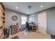 This home office features painted walls and wood accent wall with neutral carpet and natural light at 608 W 600 N, Fortville, IN 46040