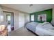 Bedroom featuring carpeting, neutral walls, and closet storage at 608 W 600 N, Fortville, IN 46040