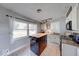 Bright kitchen featuring a functional island, white cabinetry, and modern appliances at 608 W 600 N, Fortville, IN 46040