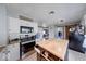Efficient kitchen with a central island, stainless steel appliances, and ample storage at 608 W 600 N, Fortville, IN 46040