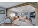 Comfortable living room featuring neutral tones, wood beam accents, and cozy seating at 608 W 600 N, Fortville, IN 46040