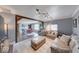 Spacious living room with wood beam details, modern lighting, and an open floor plan at 608 W 600 N, Fortville, IN 46040