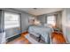 A spacious bedroom with hardwood floors and comfortable furnishings, perfect for relaxing at 608 W 600 N, Fortville, IN 46040