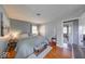 The primary bedroom has a queen bed, wood floors and ample natural light at 608 W 600 N, Fortville, IN 46040