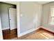Bedroom with hardwood floors, window, and closet at 613 N Tacoma Ave, Indianapolis, IN 46201
