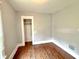 Bedroom showing neutral walls, closet space and hardwood flooring at 613 N Tacoma Ave, Indianapolis, IN 46201