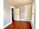 Cozy bedroom with wood floors, natural light, and closet space at 613 N Tacoma Ave, Indianapolis, IN 46201