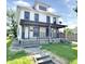 Charming two-story home featuring a covered porch and traditional design elements at 613 N Tacoma Ave, Indianapolis, IN 46201