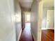 Hallway leading to rooms with wood flooring and natural light at 613 N Tacoma Ave, Indianapolis, IN 46201