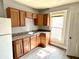 Functional kitchen with wood cabinets and modern sink at 613 N Tacoma Ave, Indianapolis, IN 46201