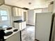 Kitchen featuring white cabinets and basic appliances at 613 N Tacoma Ave, Indianapolis, IN 46201