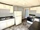 Kitchen with white cabinets and basic appliances at 613 N Tacoma Ave, Indianapolis, IN 46201