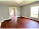Bright living room with beautiful wood floors and a large window at 613 N Tacoma Ave, Indianapolis, IN 46201