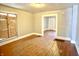 Bright living room featuring hardwood floors and neutral paint at 613 N Tacoma Ave, Indianapolis, IN 46201