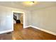 Open living room with hardwood floors and staircase at 613 N Tacoma Ave, Indianapolis, IN 46201