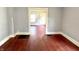 Bright living room with beautiful wood floors, showcasing its inviting entrance at 613 N Tacoma Ave, Indianapolis, IN 46201