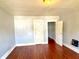 Living room with wood floors and light walls at 613 N Tacoma Ave, Indianapolis, IN 46201