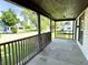 This covered front porch provides a relaxing space with neighborhood views at 613 N Tacoma Ave, Indianapolis, IN 46201