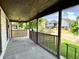 Covered front porch providing a cozy outdoor space to relax and enjoy the neighborhood views at 613 N Tacoma Ave, Indianapolis, IN 46201