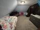 Cozy attic bedroom with sloped ceilings and playful decor at 627 Plum St, Noblesville, IN 46060