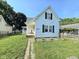 Charming white home with a well-manicured lawn and inviting front porch at 627 Plum St, Noblesville, IN 46060