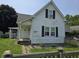 Charming two-story home featuring a cozy porch and classic shutters at 627 Plum St, Noblesville, IN 46060