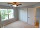 Bedroom featuring neutral walls, carpet, closet, and a bright window at 6412 Cradle River Dr, Indianapolis, IN 46221